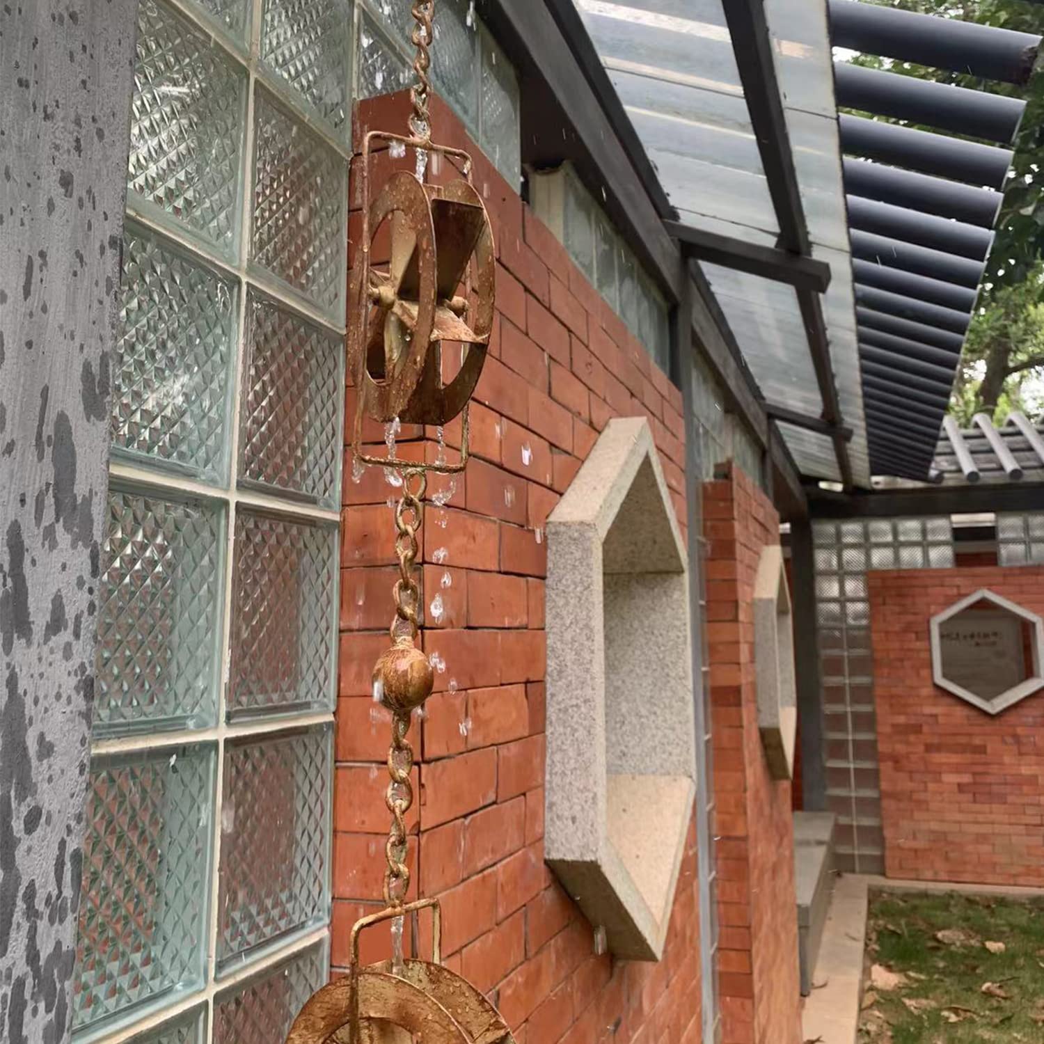 AINISIS rain chain over basin showing scale and controlled water collection