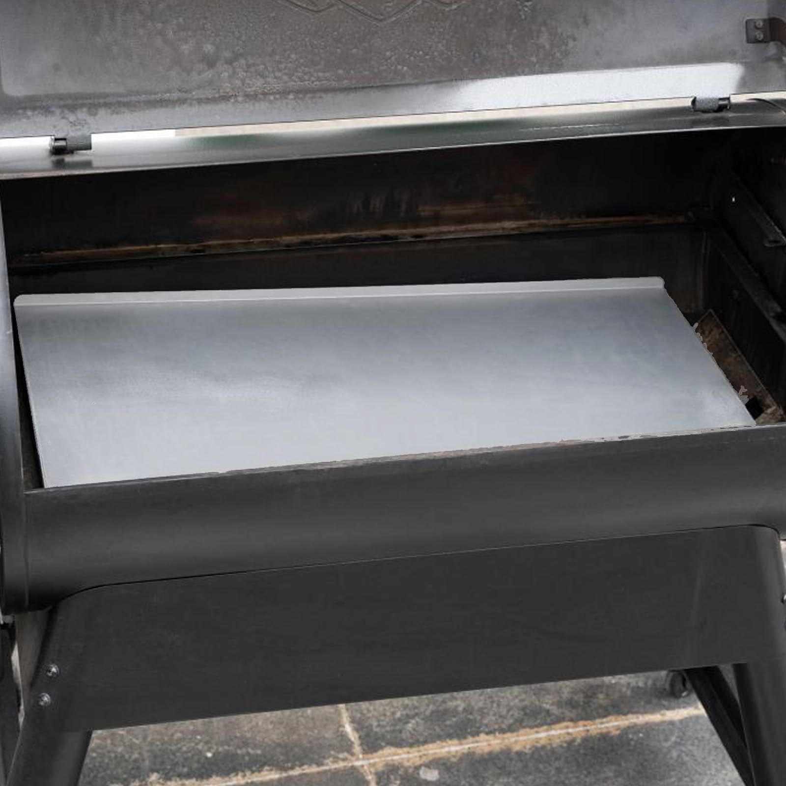 AJinTeby grease collection closeup showing easy cleanup benefit