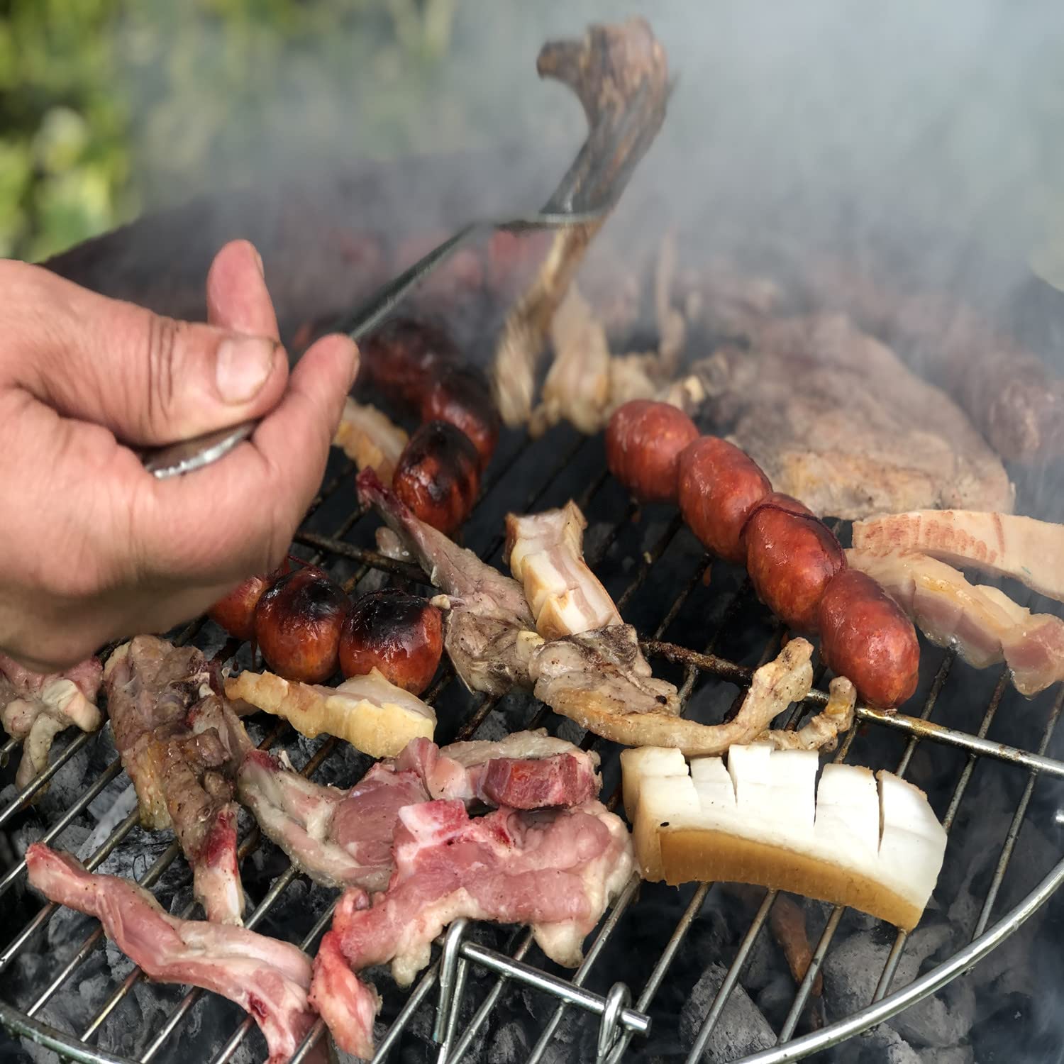 AJinTeby cooking grate in use over charcoal illustrating even heat