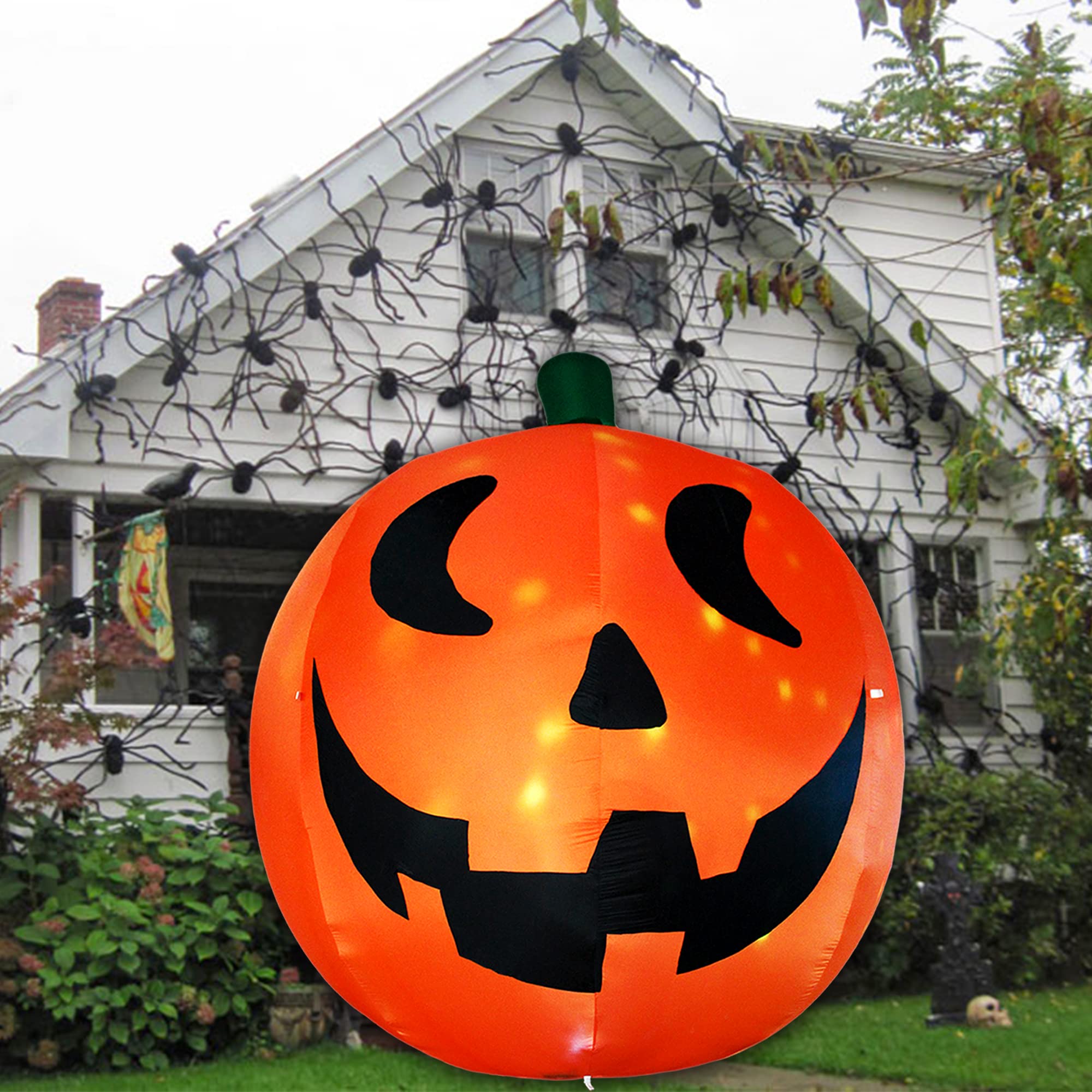 AJY pumpkin beside a person showing 10ft scale for dramatic yard presence