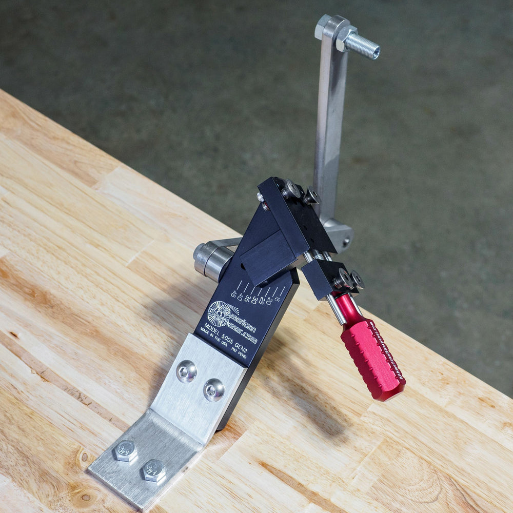 All American Sharpener mounted on mower deck illustrating in-place blade sharpening convenience