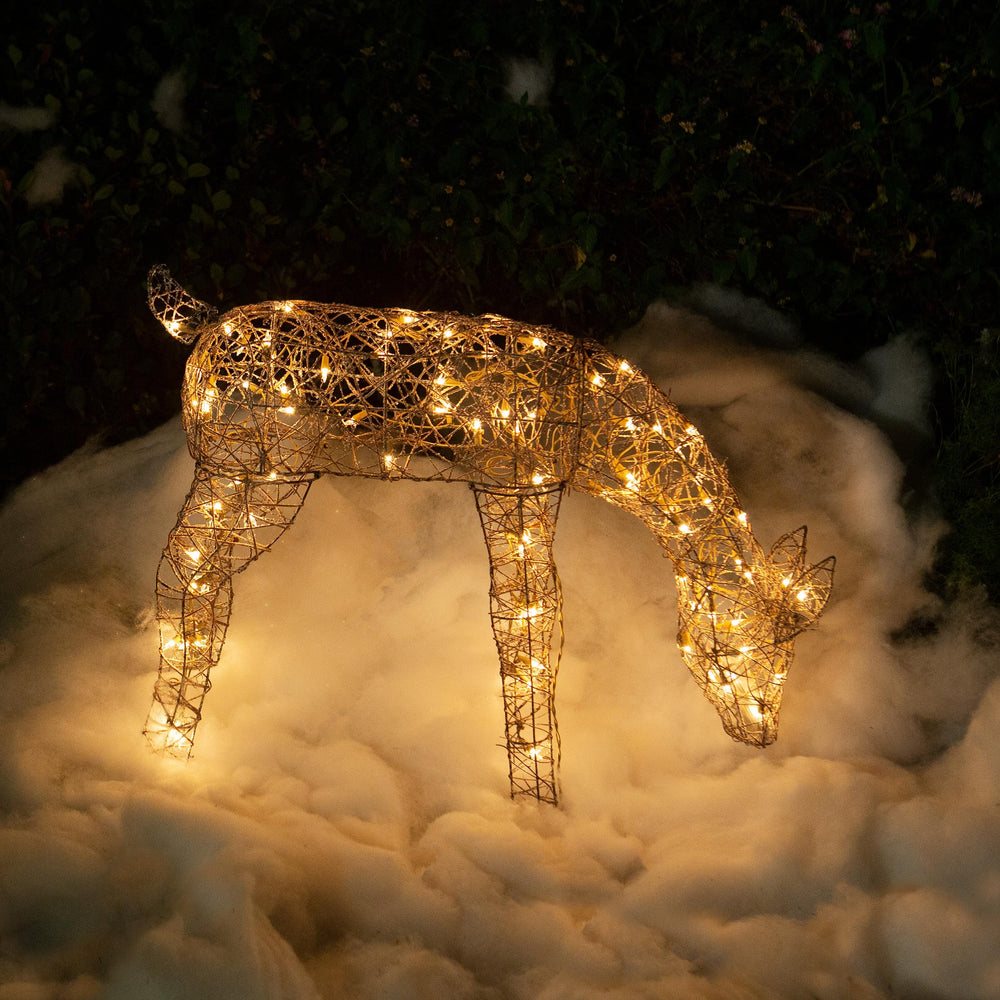 Alpine Corporation reindeer next to chair to show scale and placement options
