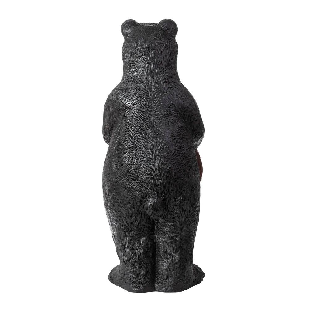 Alpine Corporation black bear placed in garden offering whimsical curb appeal