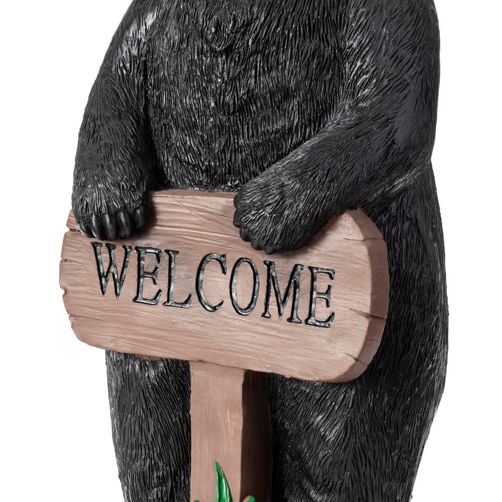 Alpine Corporation black bear near pond showing reflective decorative effect