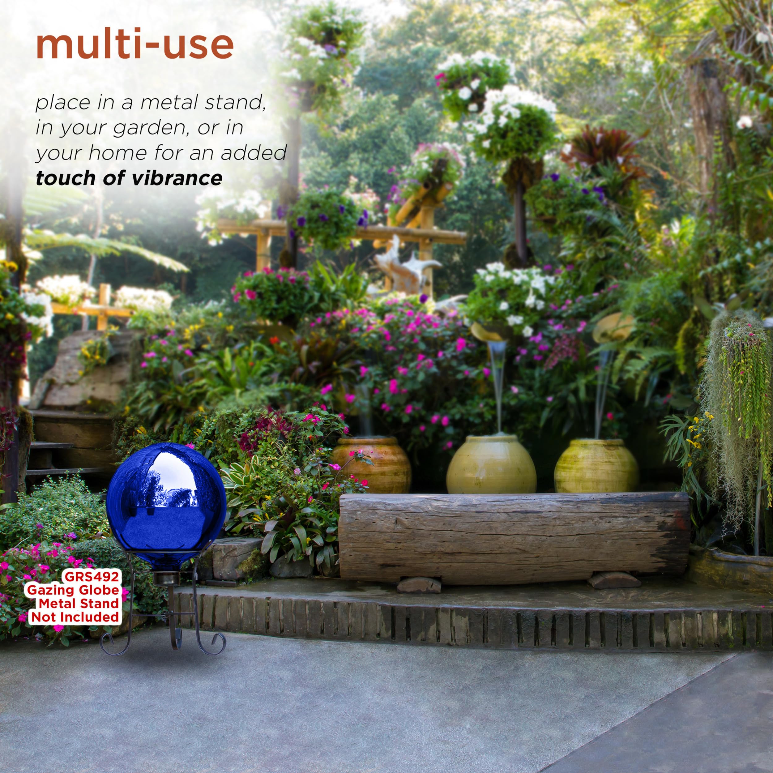 Alpine Corporation gazing globe nestled in flower bed adding color and depth
