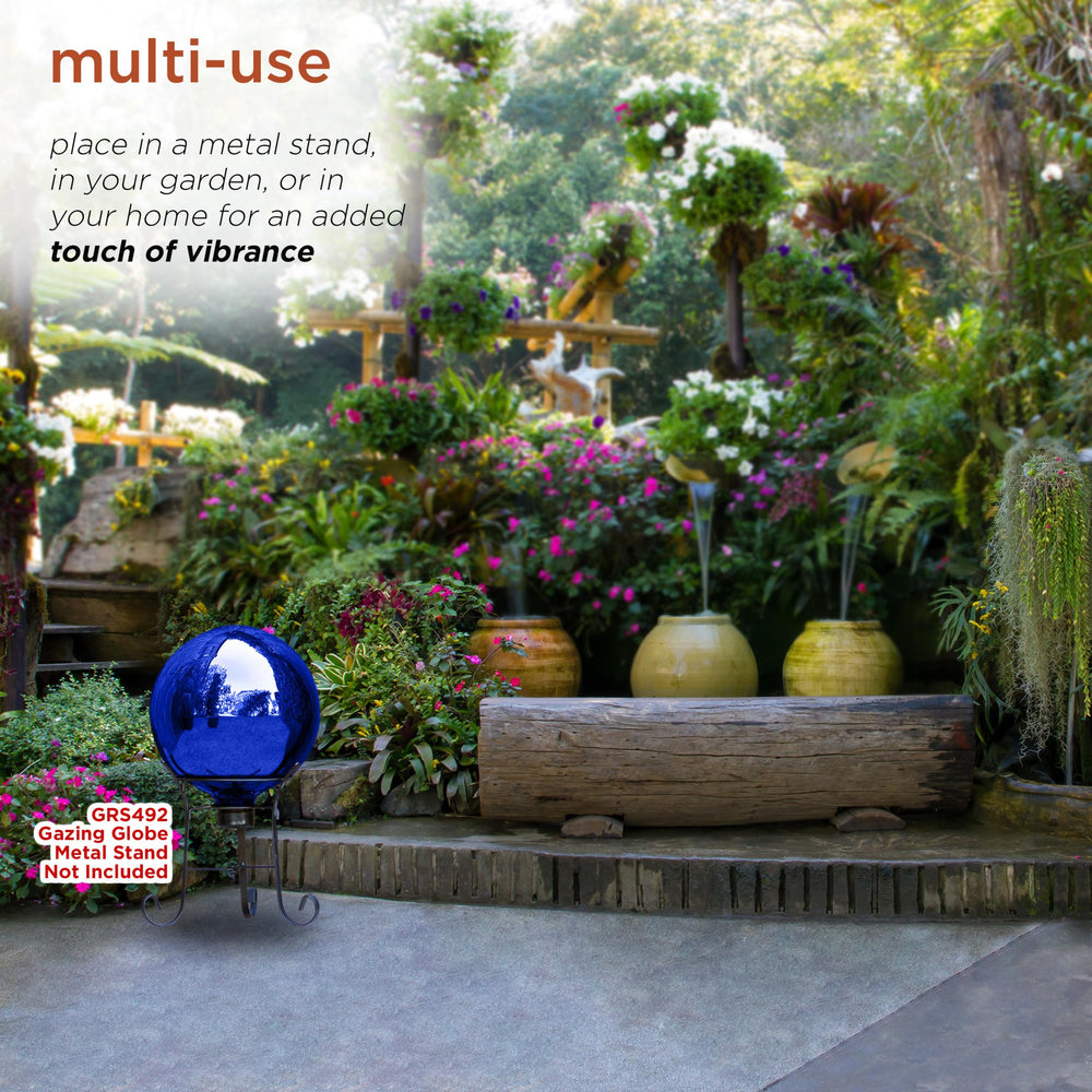 Alpine Corporation gazing globe nestled in flower bed adding color and depth