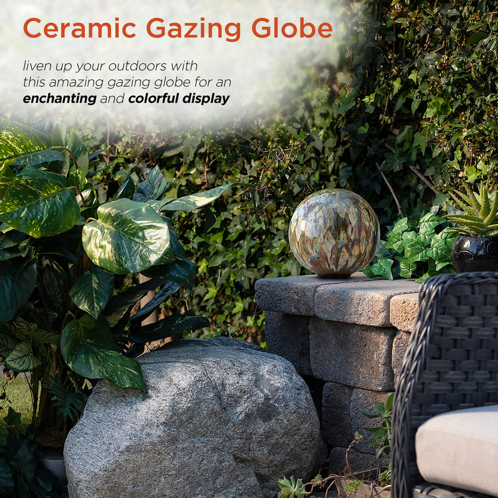 Alpine Corporation globe displayed on metal stand adding vertical garden interest