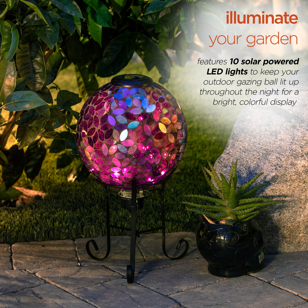 Alpine Corporation globe lit at night creating warm ambient garden lighting