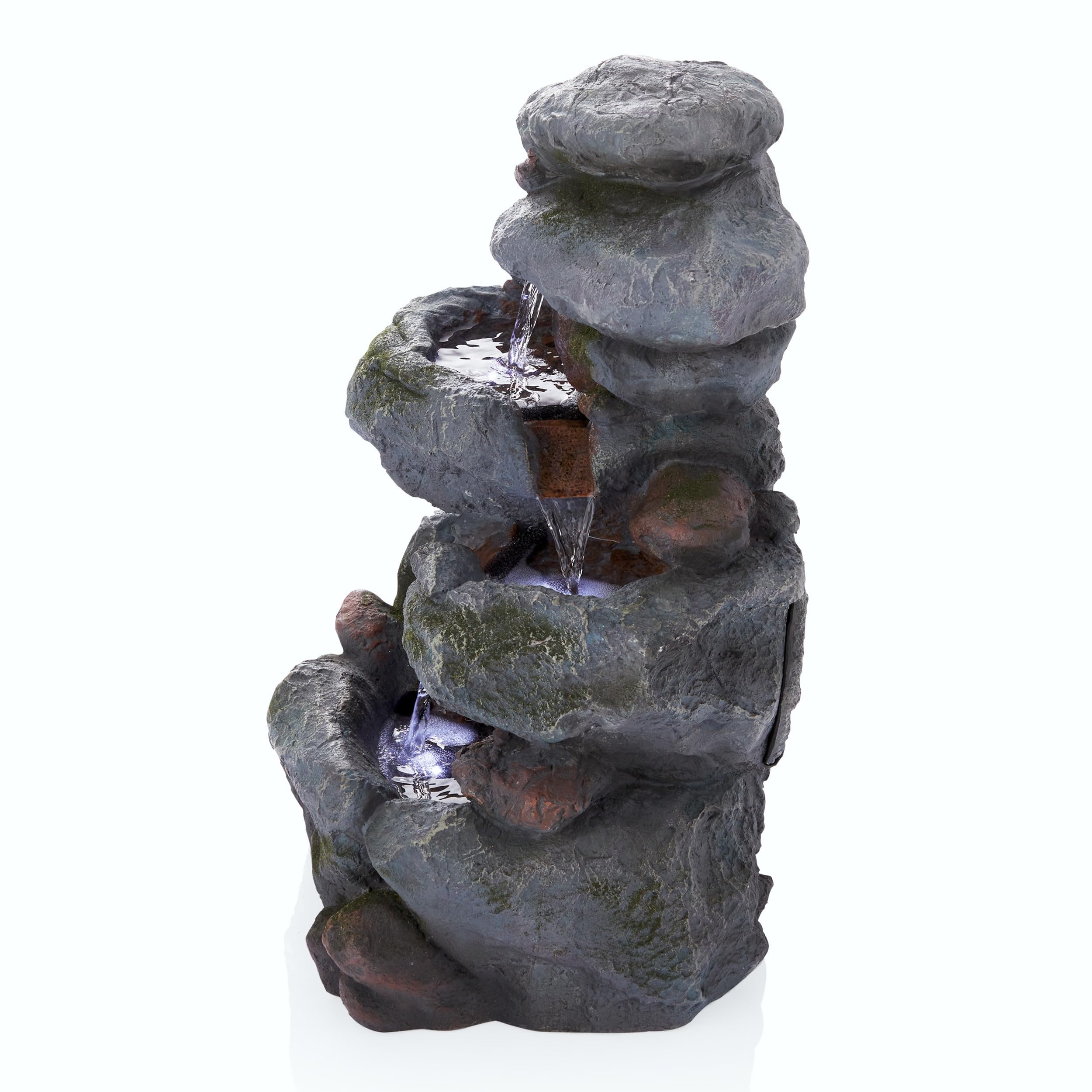 Alpine Corporation fountain in garden setting creating soothing sound among plants