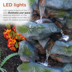 Alpine Corporation fountain lit by LEDs at night adding soft ambient lighting