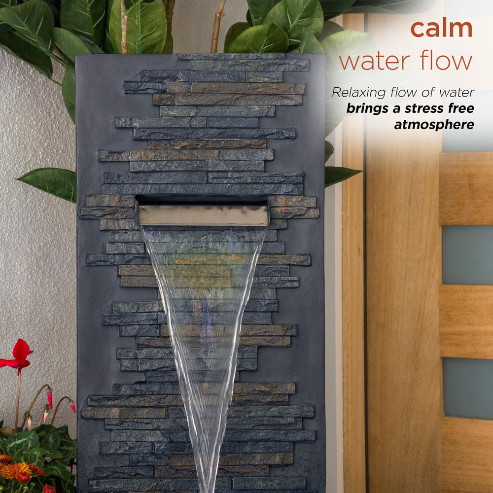 Alpine Corporation fountain mounted on patio wall illustrating simple outdoor placement