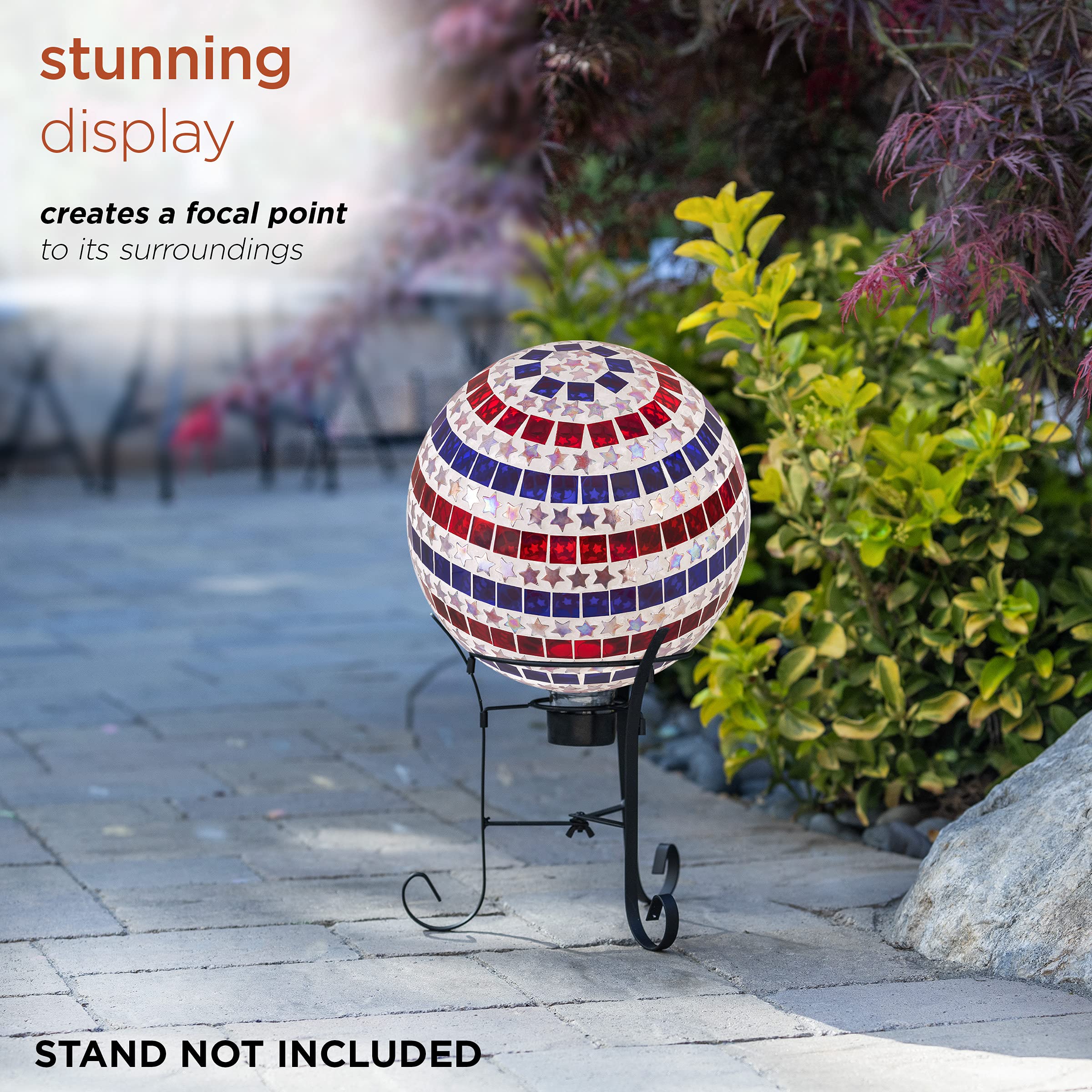Alpine Corporation gazing globe in a garden bed adding patriotic color and light