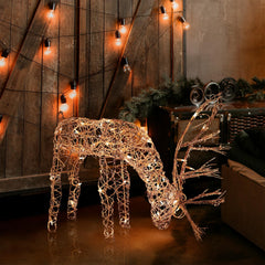 Alpine Corporation rattan reindeer front view showing warm white LEDs and festive curb appeal