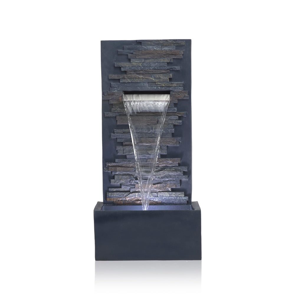 Alpine Corporation fountain next to chair showing size and scale for small spaces