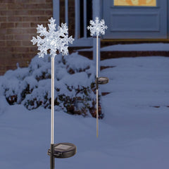 Alpine Corporation front view of snowflake stakes showing crisp white LEDs and festive look