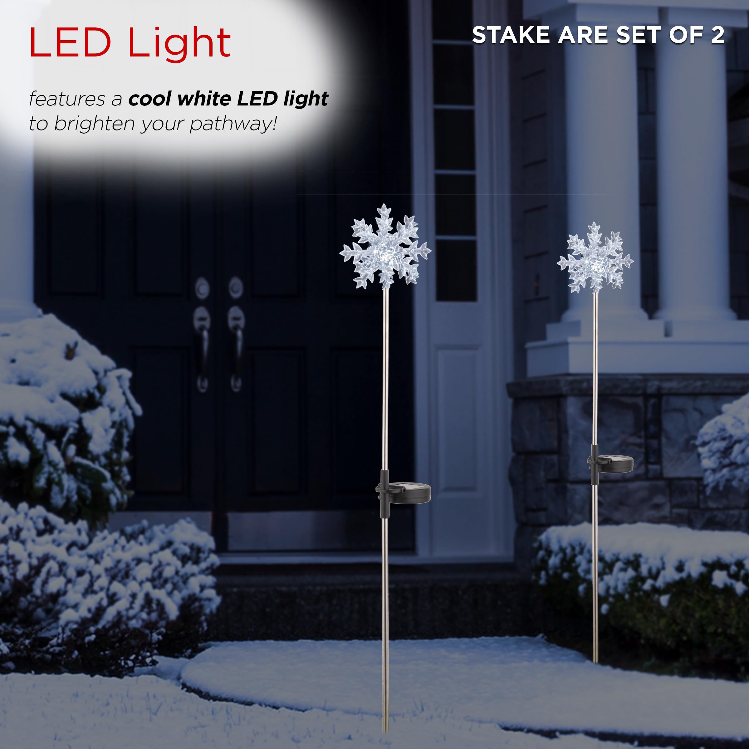 Alpine Corporation snowflake stakes lit in garden at night creating welcoming glow
