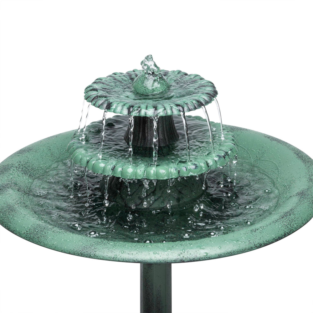 Alpine Corporation fountain next to chair for scale showing compact height fits small spaces