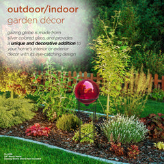 Alpine Corporation red sphere nestled in a garden bed enhancing plant colors