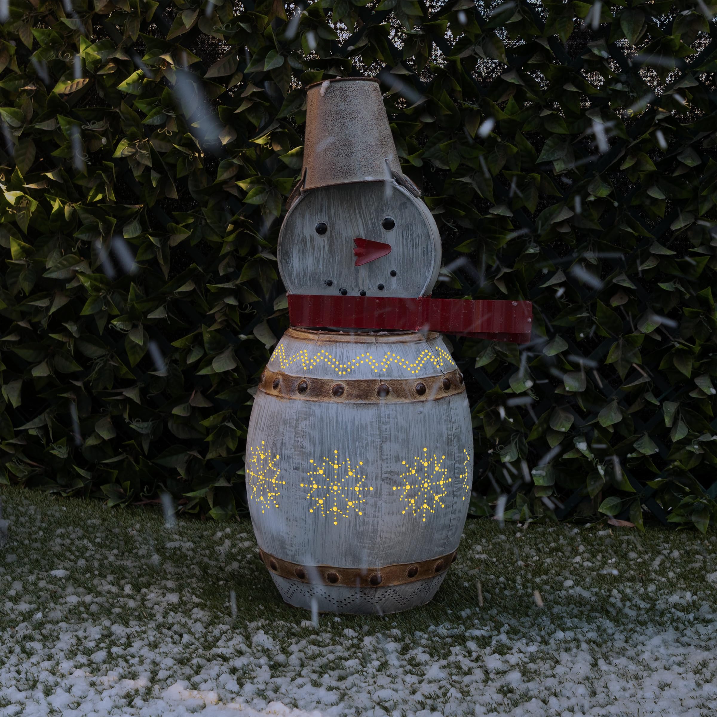 Alpine Corporation snowman front view showing rustic metal body and warm glow