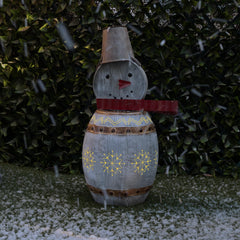 Alpine Corporation snowman front view showing rustic metal body and warm glow