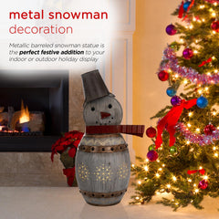 Alpine Corporation snowman illuminated at night creating cozy outdoor ambiance