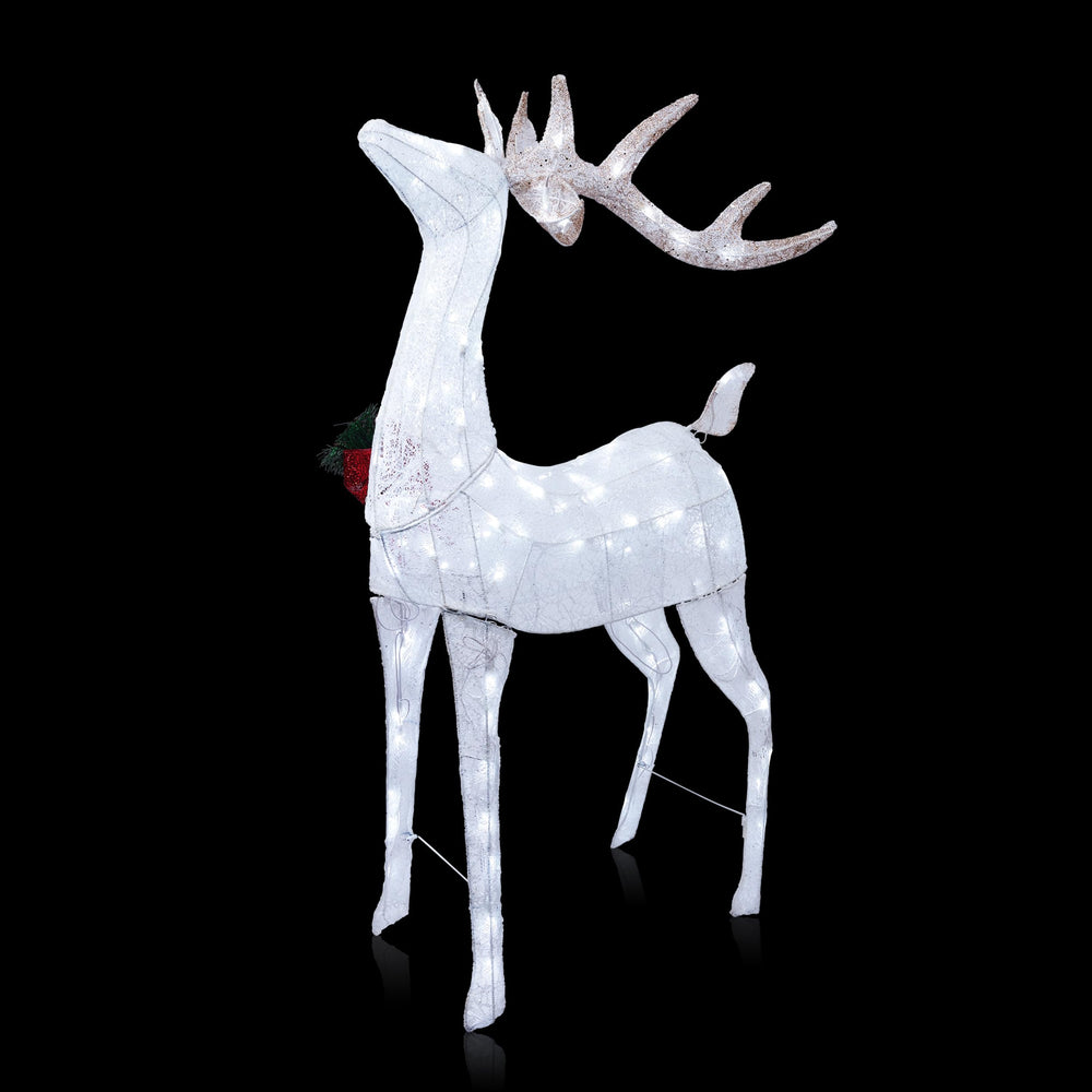 Alpine Corporation hands staking reindeer showing easy outdoor installation