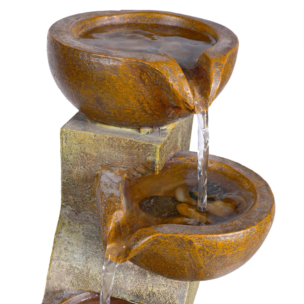 Alpine Corporation fountain on patio emphasizing outdoor ambiance benefit
