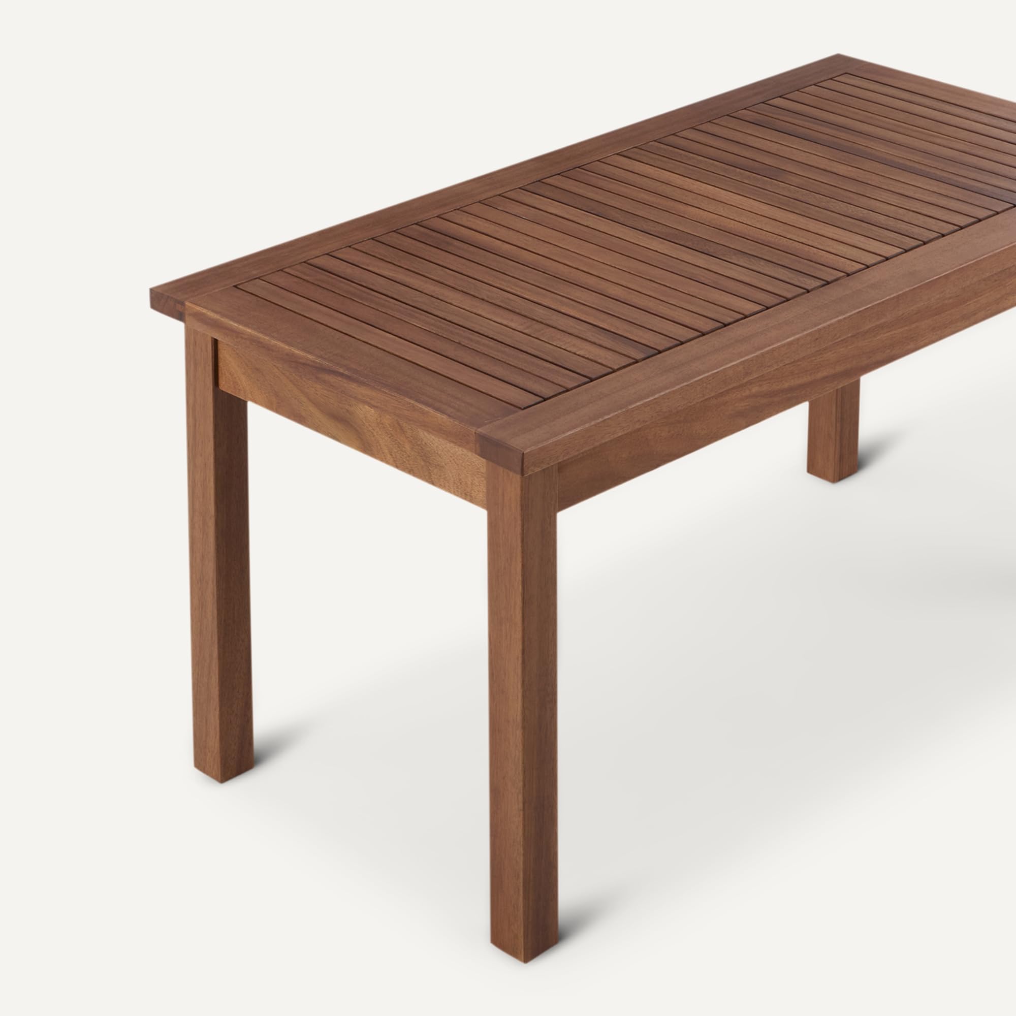 Amazon Basics table in use on porch holding drinks and plants demonstrating functionality