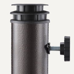 Amazon Basics umbrella stand in use on a deck supporting a patio umbrella to create shaded seating