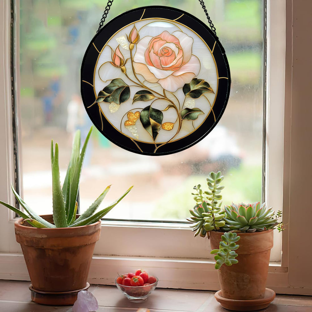AMDERVEN suncatcher hanging in window creating cheerful rose-toned light