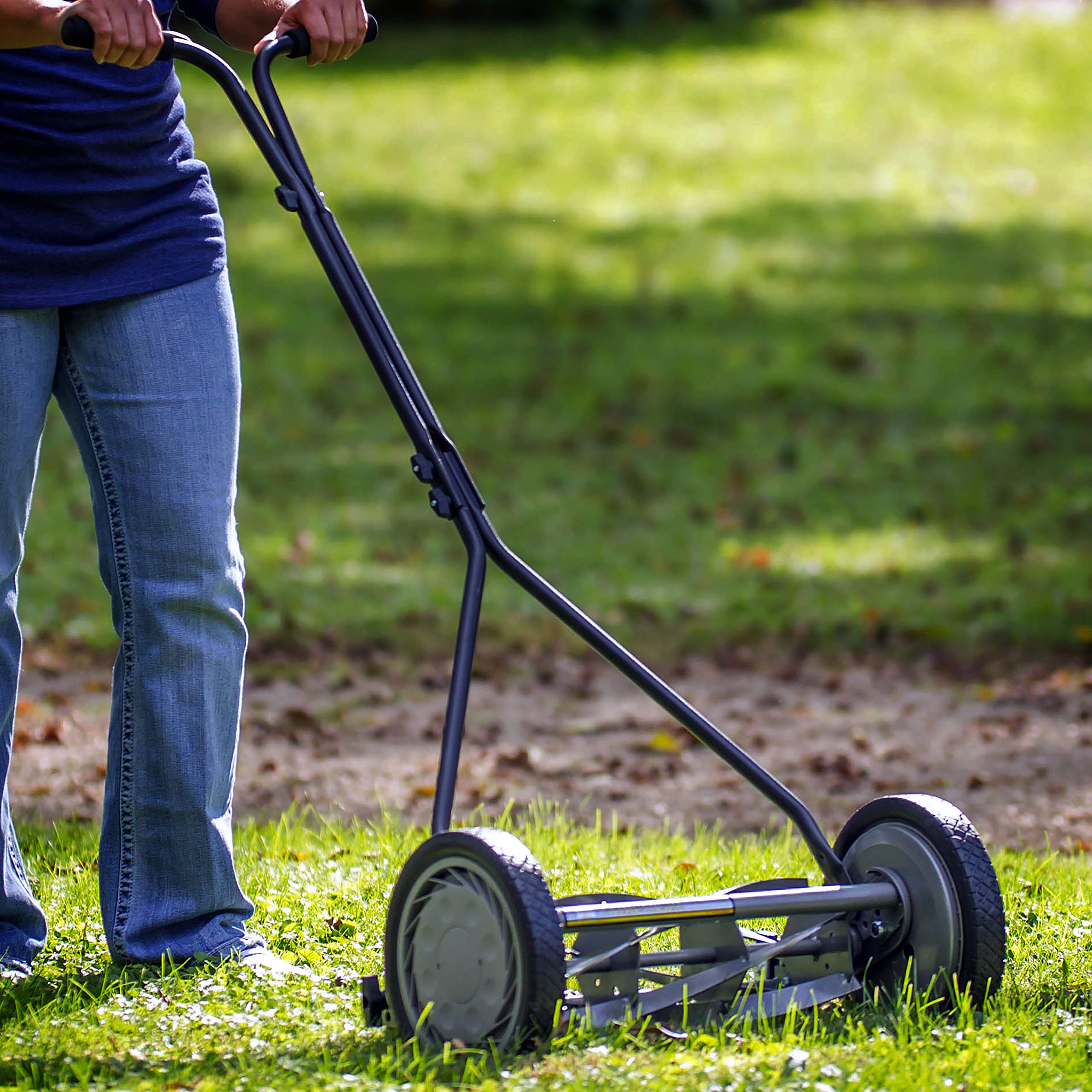 American Lawn Mower in a backyard lifestyle scene showing tidy lawn results