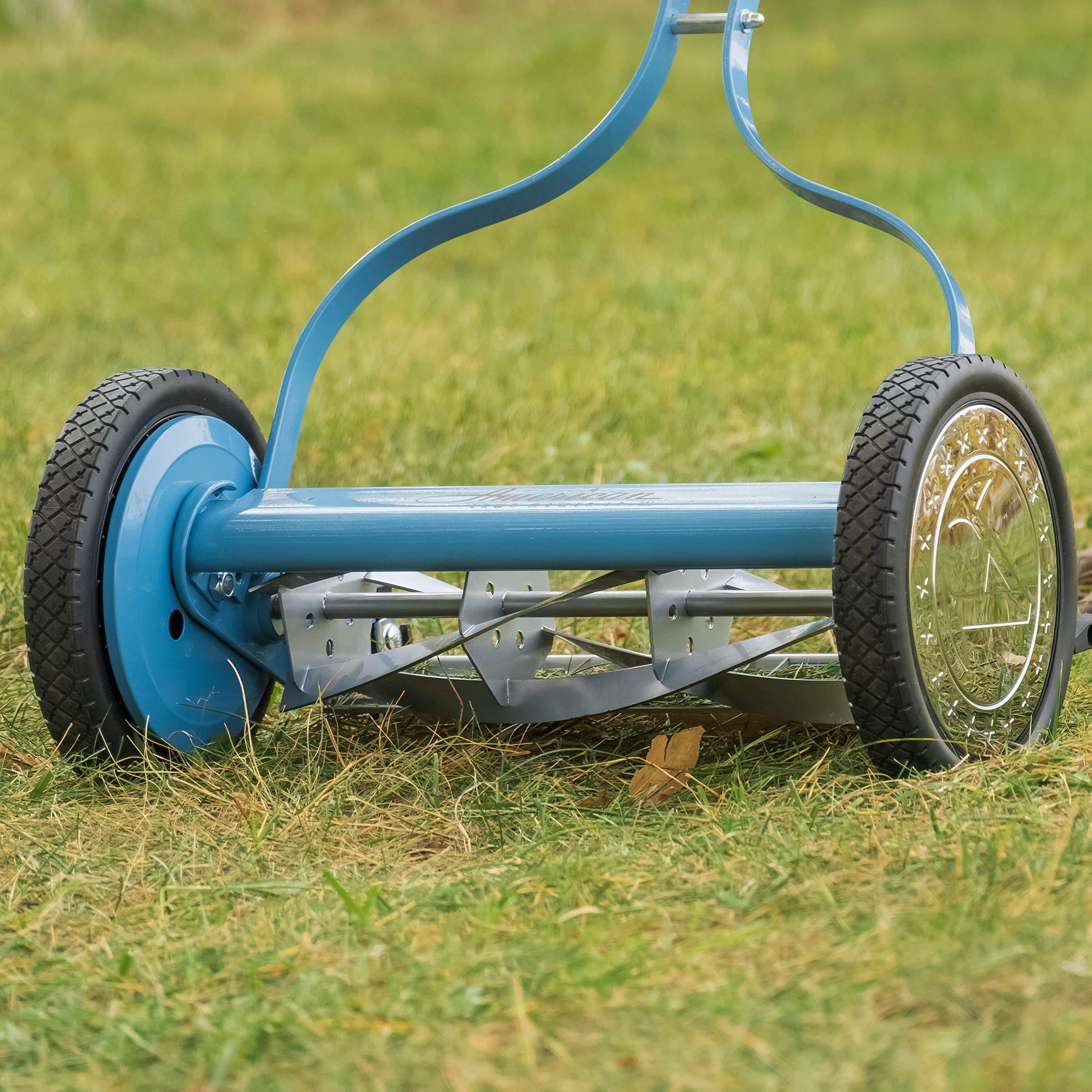 American Lawn Mower Company reel blades turning in grass showing clean scissor-like cut