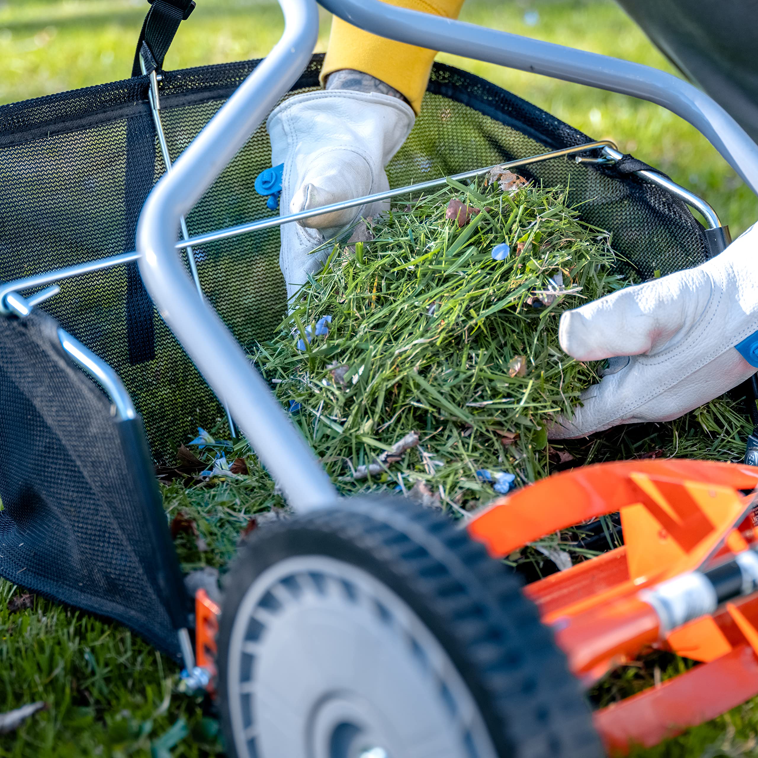 American Lawn Mower Company catcher next to hand for scale showing real size advantage