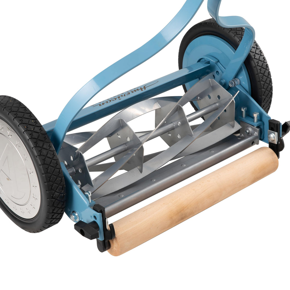 American Lawn Mower Company unboxed parts including wheels and handle for quick assembly