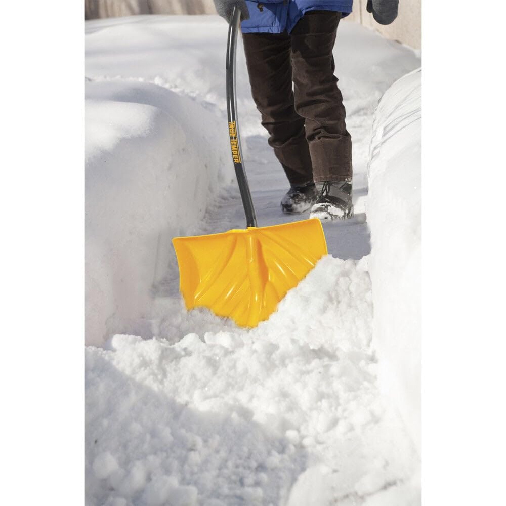 AMES True Temper shovel in use pushing snow on driveway for faster clearing