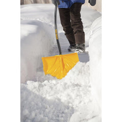 AMES True Temper shovel in use pushing snow on driveway for faster clearing