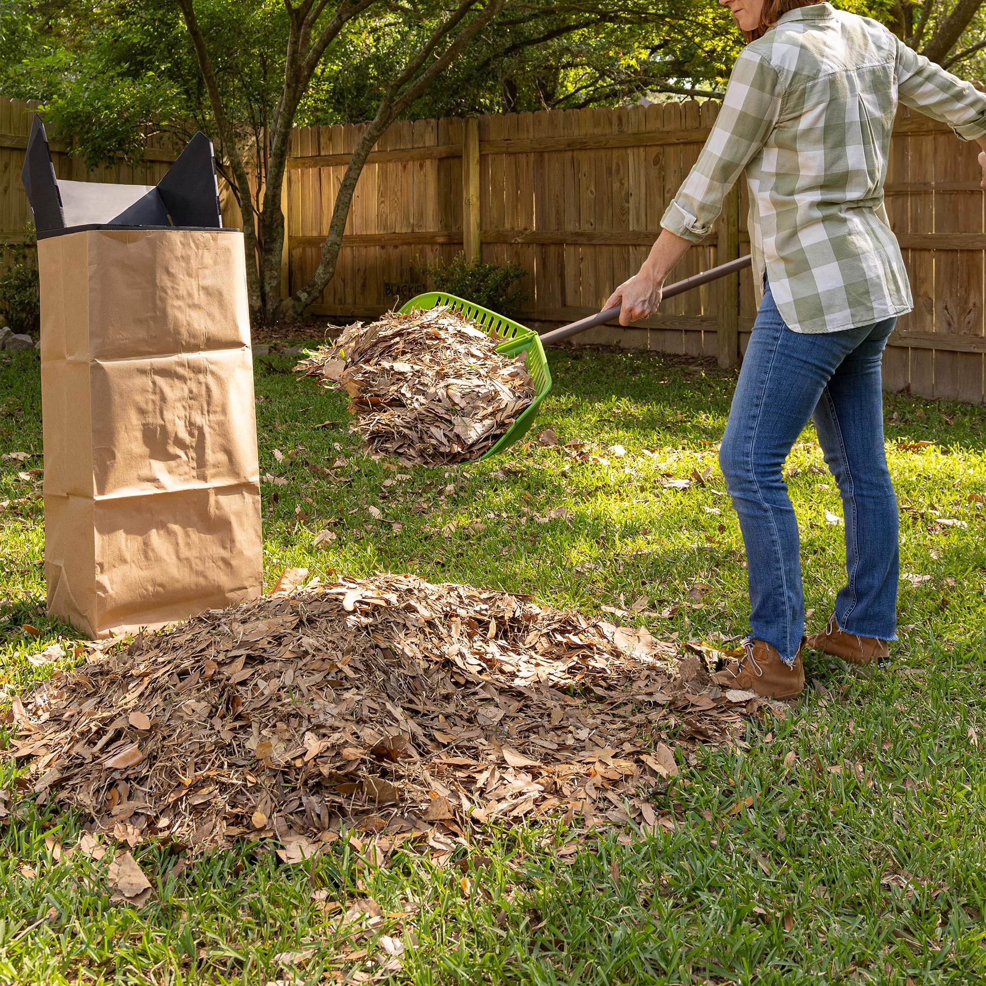 AMES rake in use gathering leaves into a pile for quicker yard work