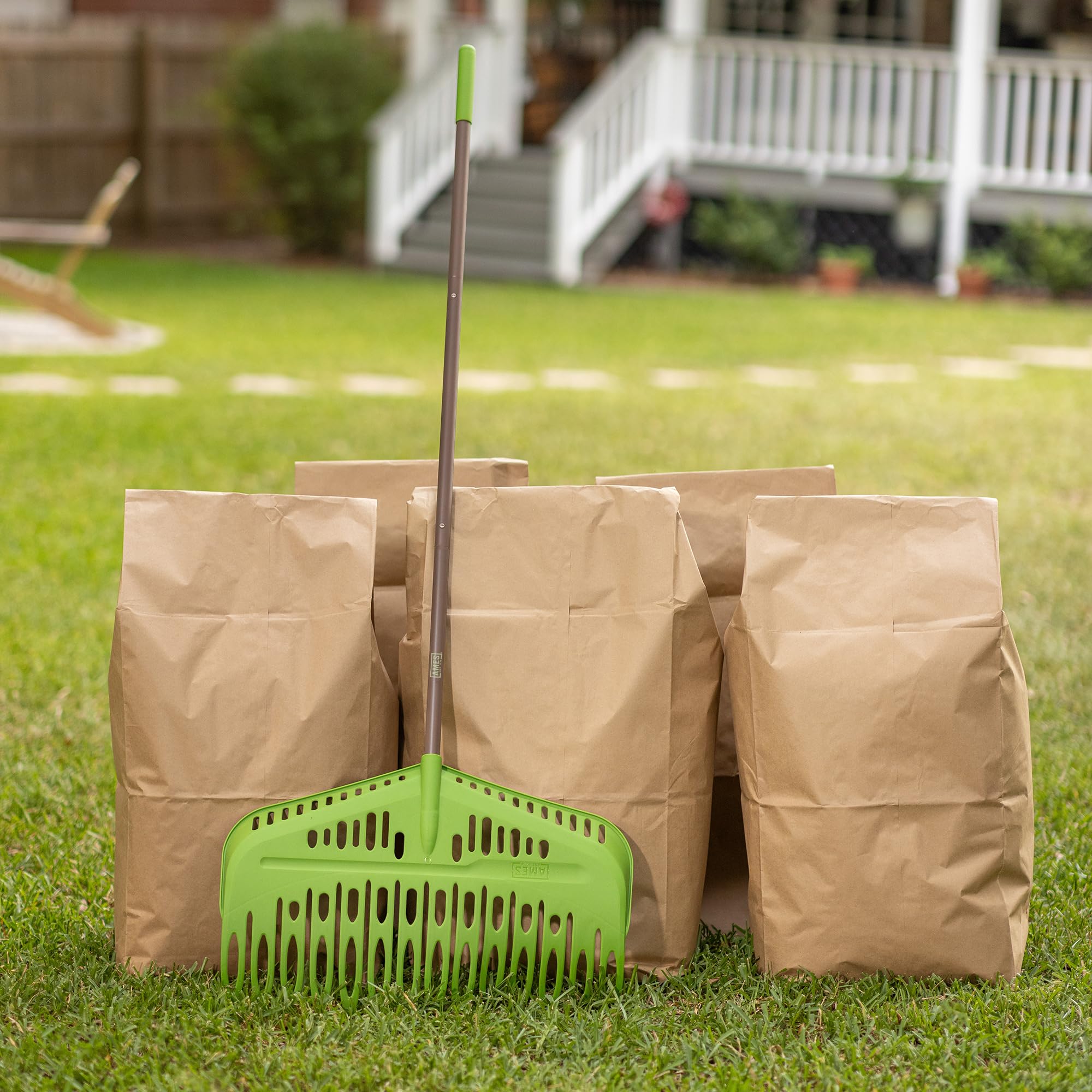 AMES rake transferring leaves into yard bag to speed collection and reduce bending