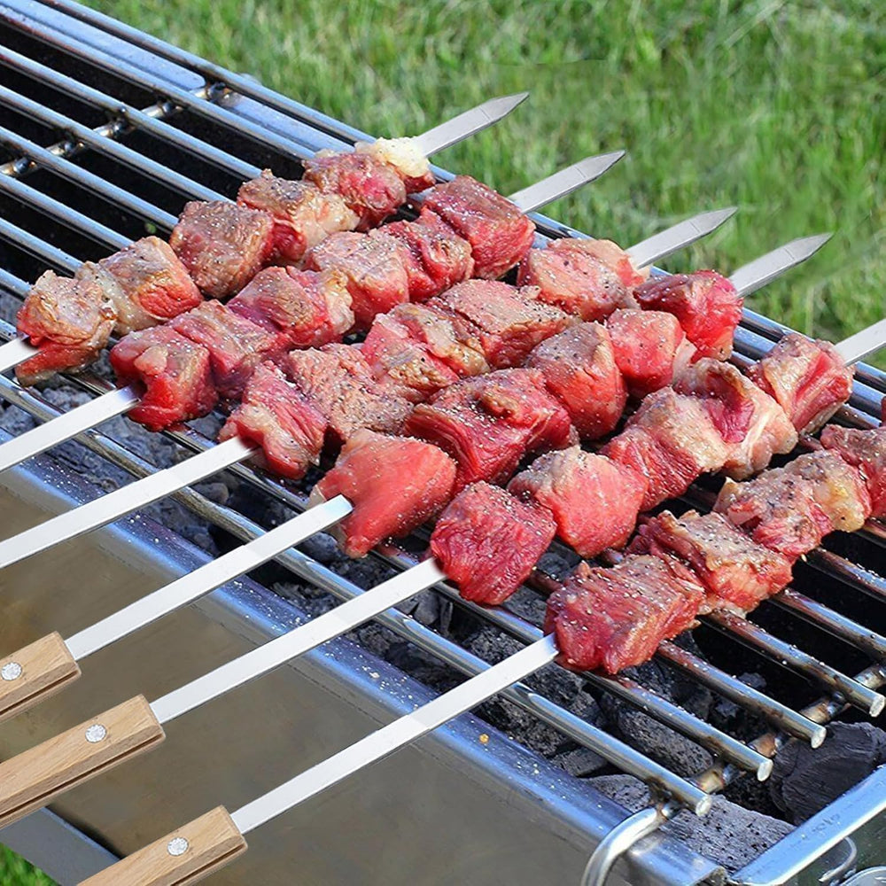 Amestar skewers beside a ruler showing 23.5-inch length for large kebabs