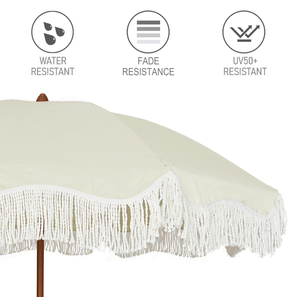 AMMSUN umbrella in use at beach providing cool shaded spot