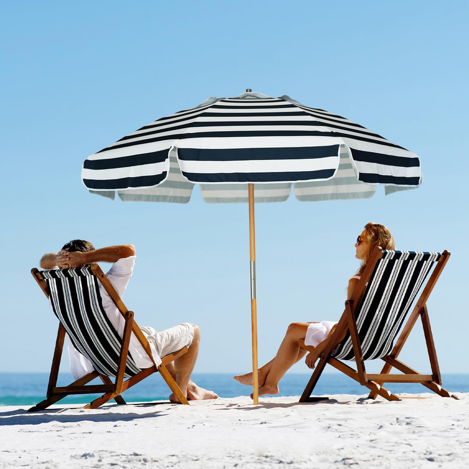 AMMSUN umbrella beside beach towel to show 7.5ft size and scale