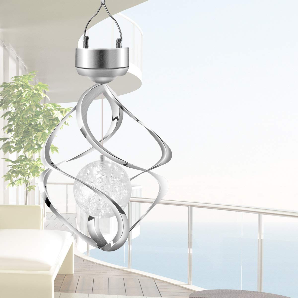 AMWGIMI hanging over patio table showing mood lighting for outdoor gatherings