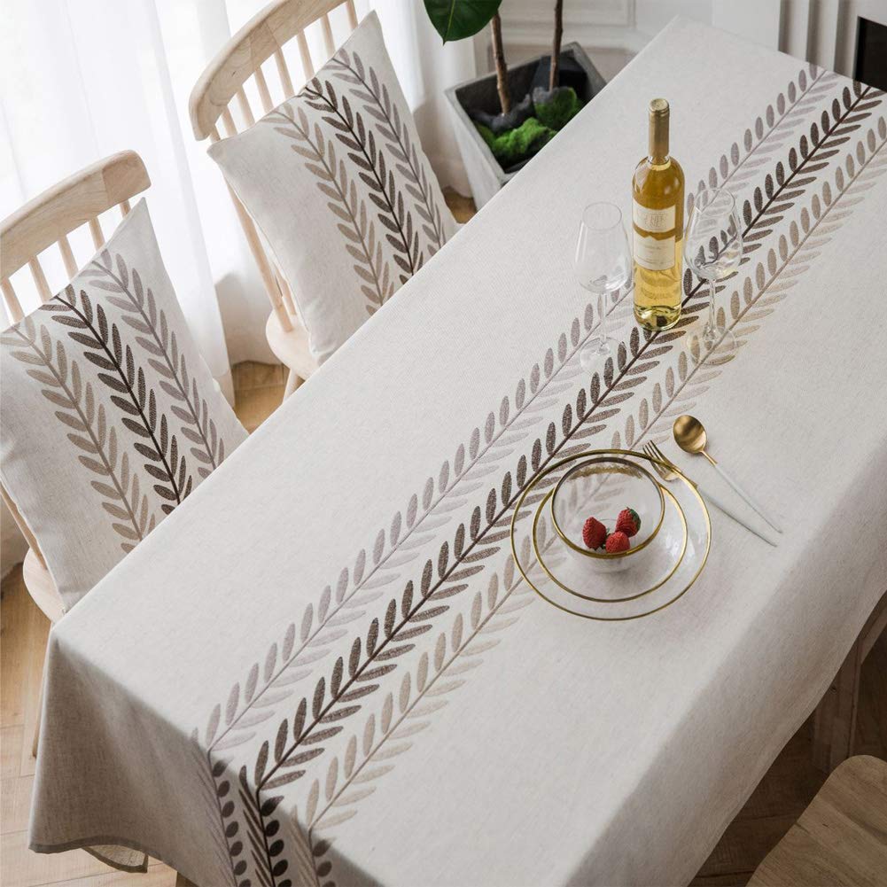 AMZALI tablecloth next to chairs for scale showing true 53 x 87 inch fit