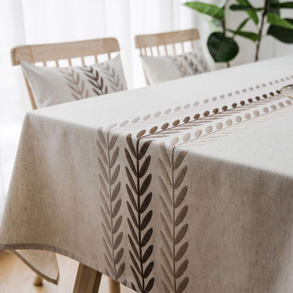 AMZALI tablecloth styled with dinnerware demonstrating polished dining presentation