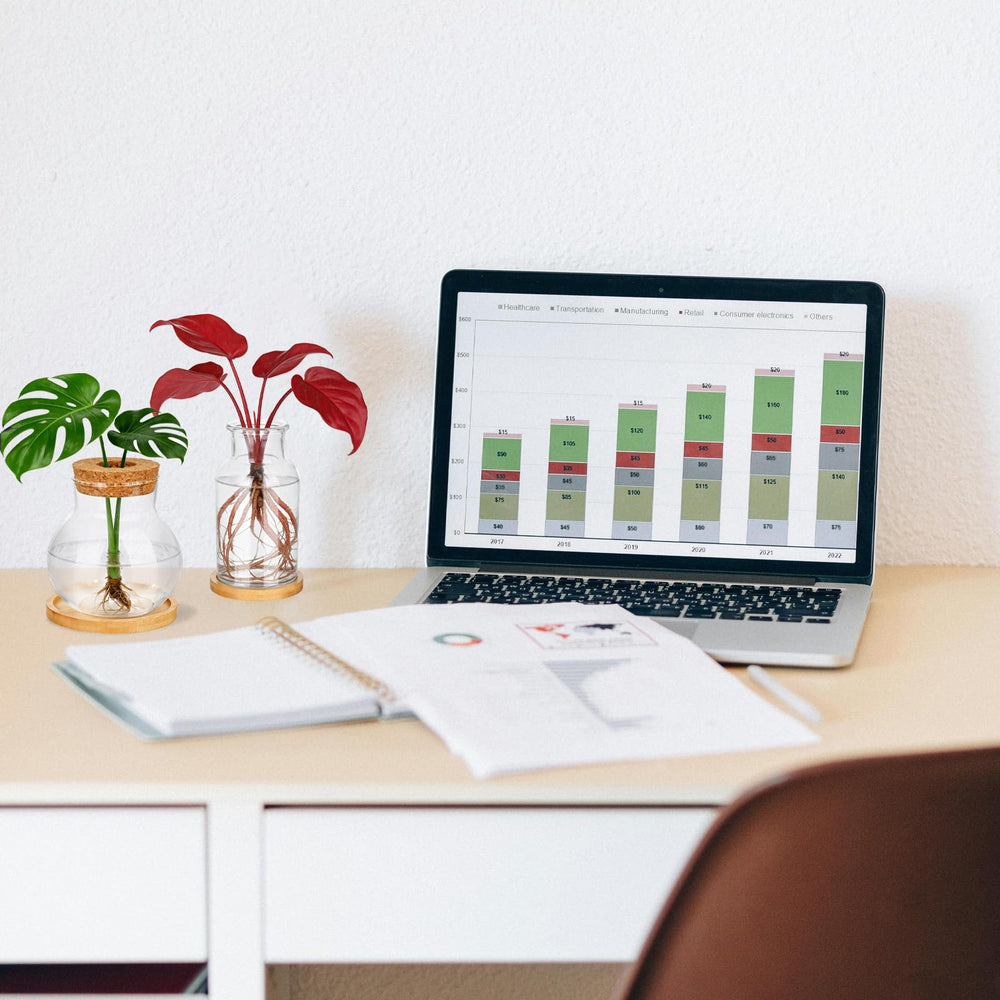 Anboliwb desk lifestyle display with vases adding decorative greenery to workspace