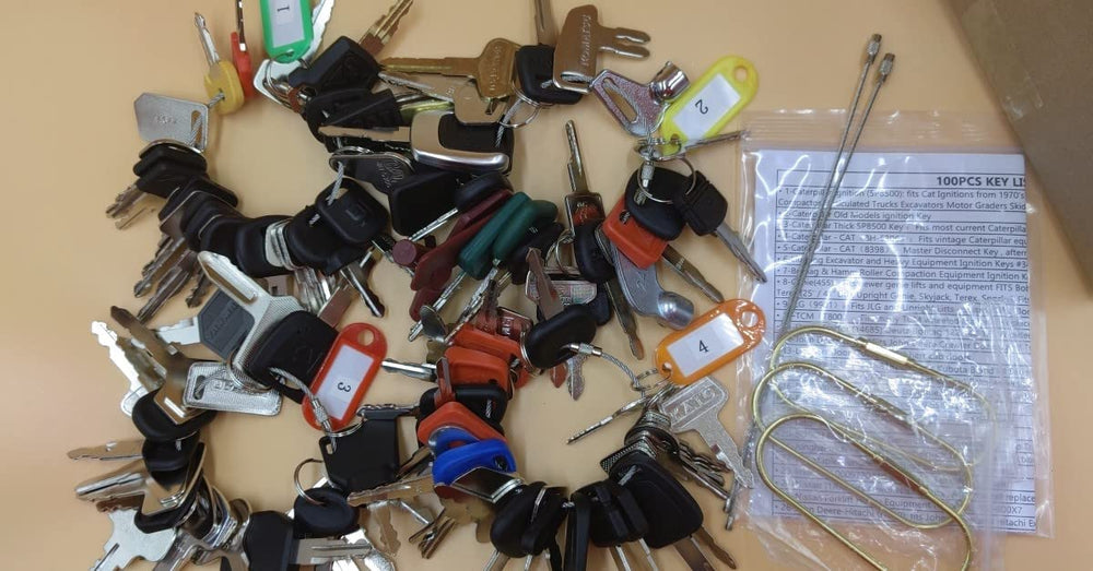 ANNHOO999 keys placed beside construction machine to show compatibility benefit