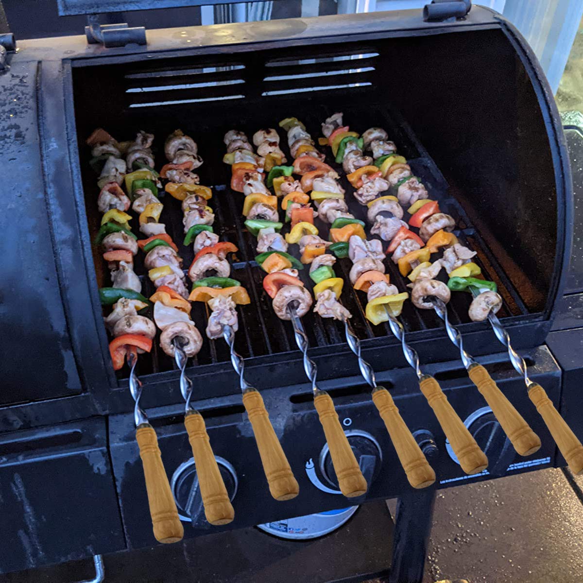 Antallcky skewers loaded with meat and vegetables showing even grilling