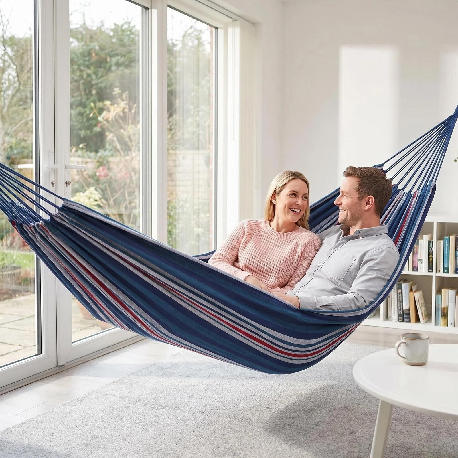 ANYOO hammock with person reclined to show scale and 660 lb capacity benefit