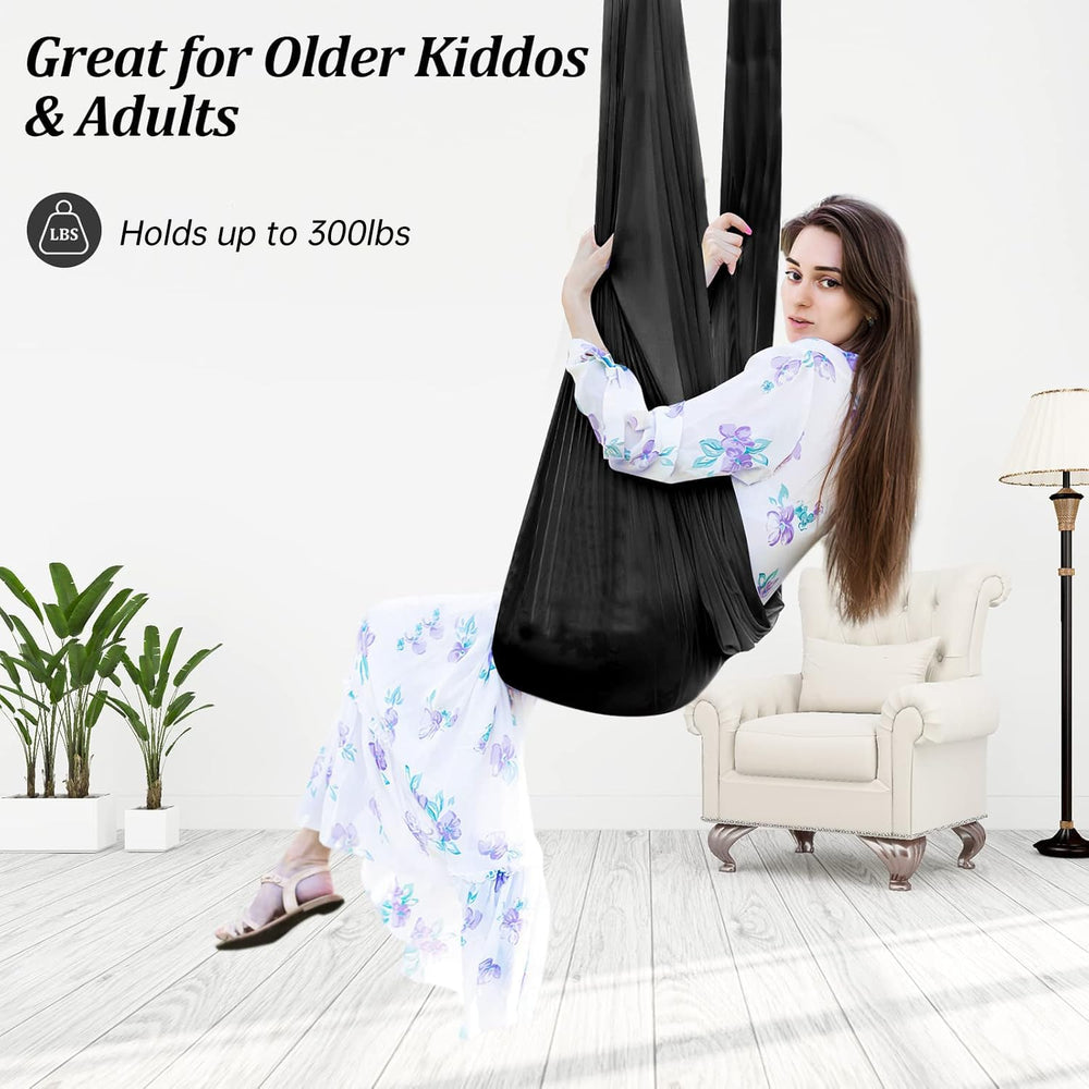 Child using Aokitec sensory swing demonstrating calming motion and safe support