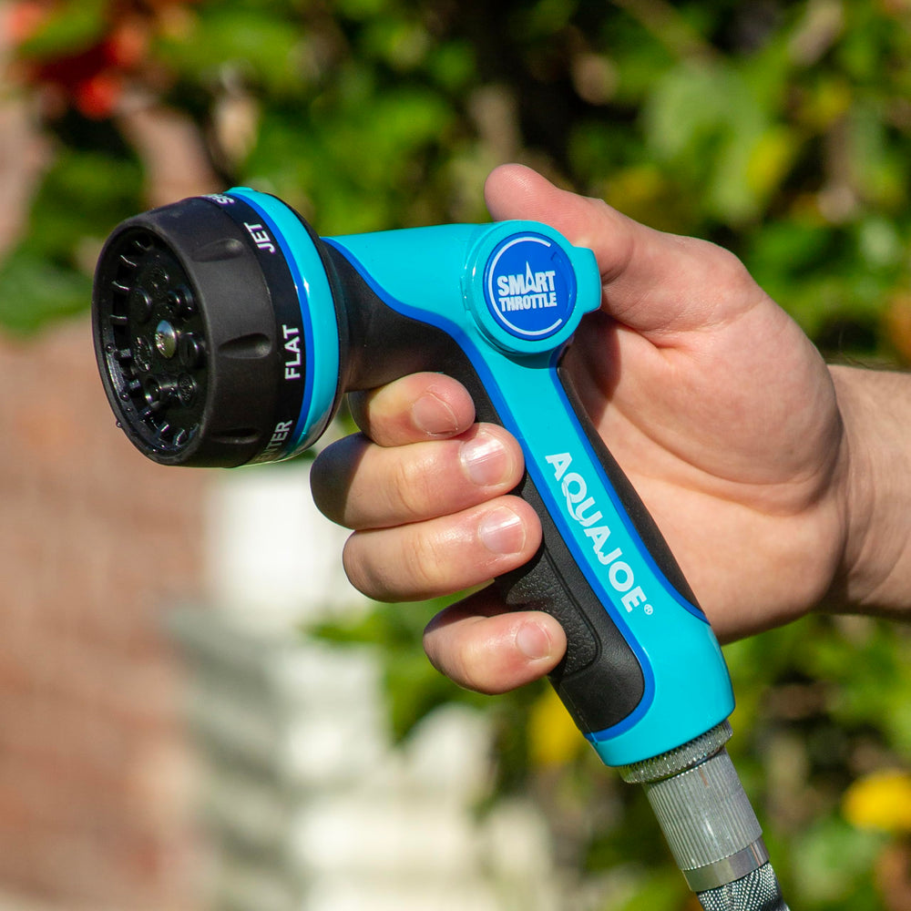 Aqua Joe nozzle spraying focused jet stream showing high-pressure cleaning power